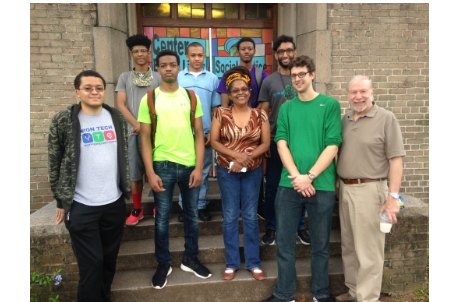 ETHS YTC students and mentors on the steps in New Orleans, where they launched two new clubs after Katrina